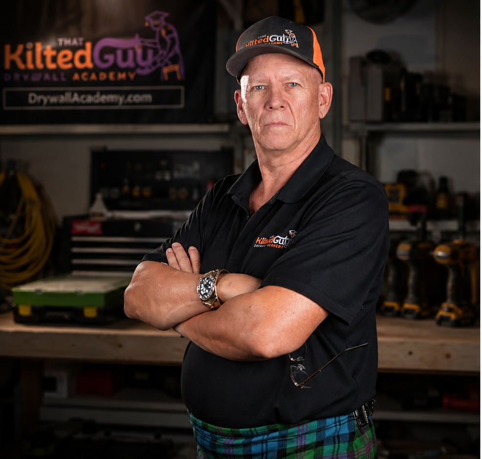 Guy in his drywall workshop